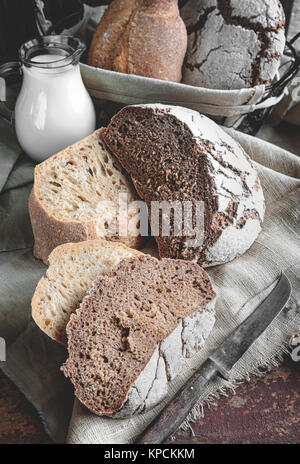 A beautiful loaf of rye farm sourdough bread is handmade. Close-up. Stock Photo