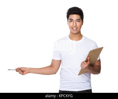 Asian man hold with clipboard and pen point aside Stock Photo