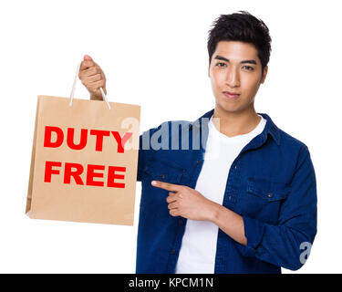 Asian mixed Indian man finger point to shopping bag for showing phrase of duty free Stock Photo