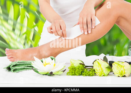 Woman Getting Legs Waxed Stock Photo
