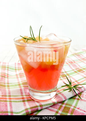 Lemonade with rhubarb and rosemary on checkered napkin Stock Photo
