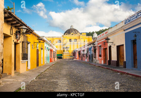 La Merced church and colonial houses in tha street view of Antigua, Guatemala.  The historic city Antigua is UNESCO World Heritage Site since 1979. Stock Photo