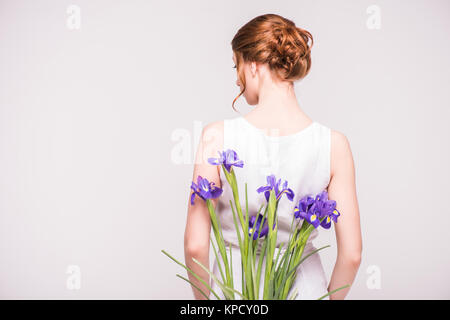 beautiful woman with iris flowers Stock Photo