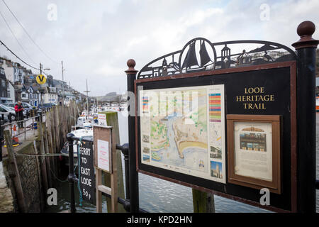 Large sign detailing the 'Looe Heritage Trail' on the harbourside at Looe, Cornwall. Stock Photo