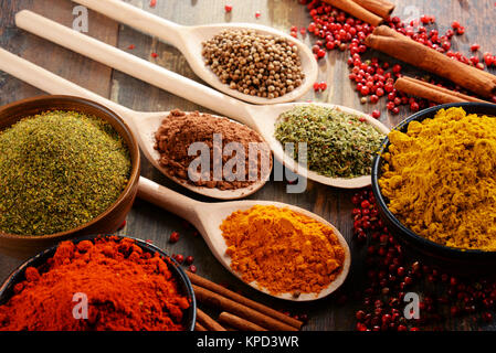 Variety of spices on kitchen table Stock Photo