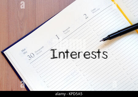 Interests write on notebook Stock Photo