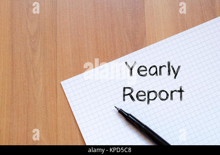 Yearly report write on notebook Stock Photo