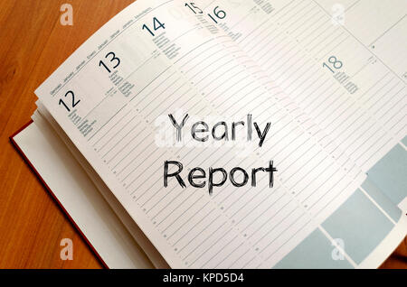 Yearly report write on notebook Stock Photo