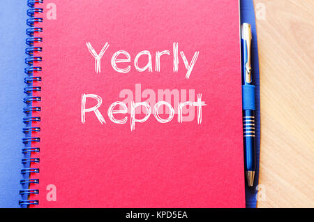 Yearly report write on notebook Stock Photo