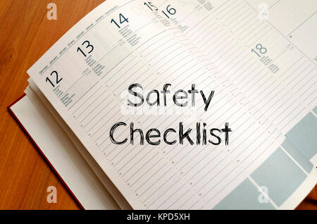 Safety checklist write on notebook Stock Photo