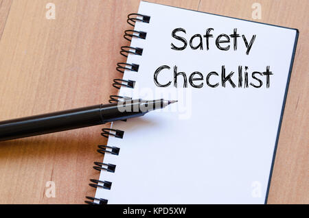 Safety checklist write on notebook Stock Photo