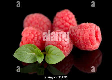 Raspberries with leaves Stock Photo