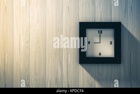 Black clock hanging on the wood wall Stock Photo