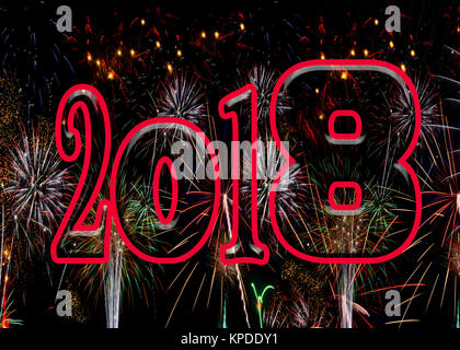 Fireworks bold red numbers 2018 New Years Eve concept exploding bursting fire works celebration ratio for A5 and 7x5 greeting card Stock Photo