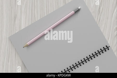 pencil on checked notebook on wood background Stock Photo