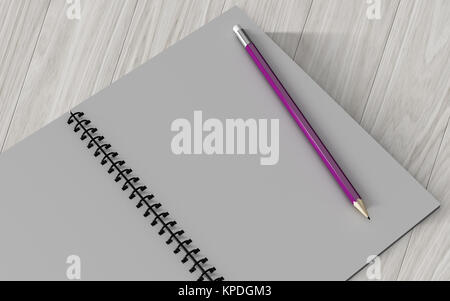 pencil on checked notebook on wood background Stock Photo