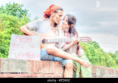 hippies play guitar outdoor Stock Photo