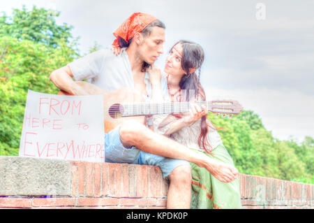 hippies play guitar outdoor Stock Photo