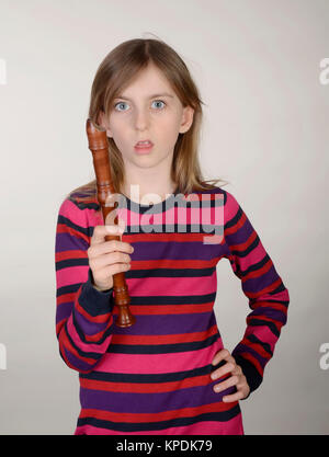 angry girl with recorder Stock Photo