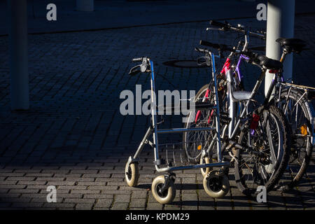 deported - out eyes - stopped - a walker next two bicycles Stock Photo