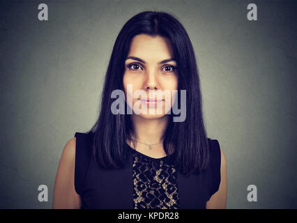 Portrait of a serious young woman looking at camera Stock Photo