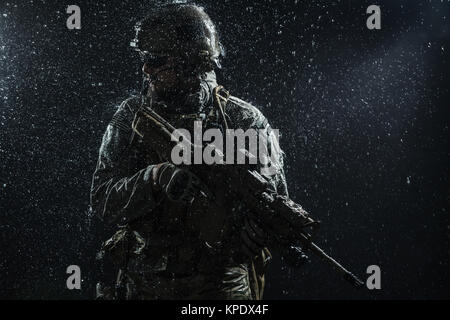 US Army soldier in the rain Stock Photo