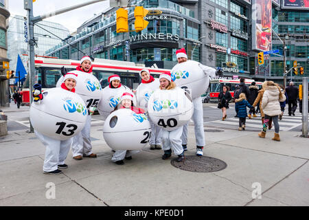Lotto Max lottery marketing consumer promotion, distribution of coupons, corner of Yonge and Dundas, Dundas Square, downtown Toronto, Ontario, Canada. Stock Photo
