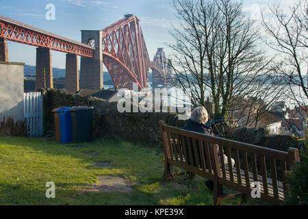 Sitting by the Forth Rail Bridge Stock Photo