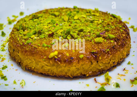 turkish dessert kunefe isolated with pistachio clipping path inside Stock Photo