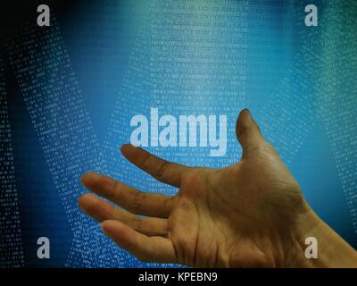 Hand in front of coding on computer screen display. Blue binary code background. Stock Photo
