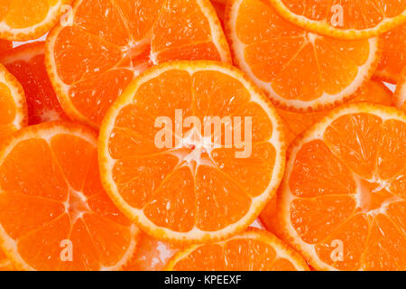 background of slices of clementine fruit Stock Photo