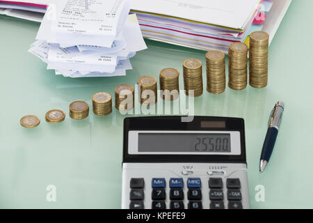 Receipts With Calculator And Money On Desk Stock Photo