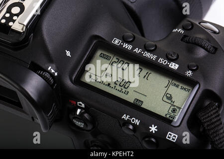 Professional modern DSLR camera - detail of the top LCD with settings - shutter speer, aperture, ISO, AF mode, battery info, RAW format indication,... Stock Photo