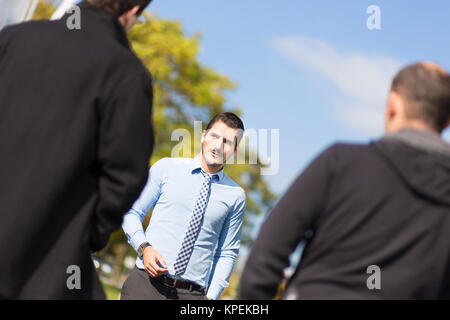 Businessman being blackmailed by two racketeers. Stock Photo
