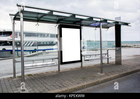 blank advertisement in a bus stop next to the sea and ships in istanbul city Stock Photo