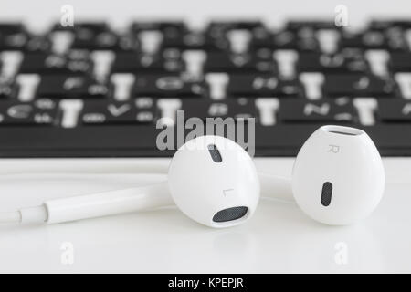 Computer peripherals and laptop accessories on white wooden background ...