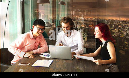 Group of young business people are happy about their project in front of Asian village showing possibilities Stock Photo