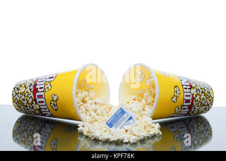 scattered popcorn from bucket with movie ticket Stock Photo