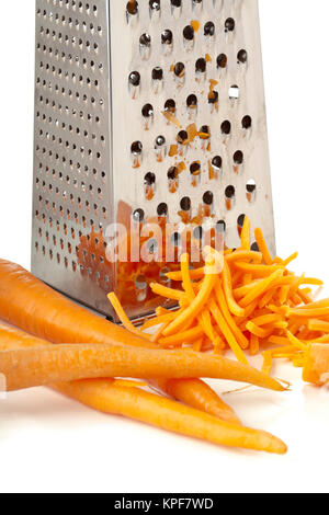 chef shredding carrots with grater in kitchen Stock Photo - Alamy