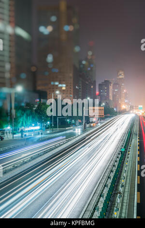 blurred traffic light trails on road in Beijing,China. Stock Photo