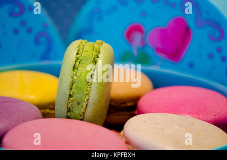 set of different french cookies macaroons in a paper box top view Stock Photo