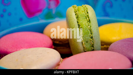 set of different french cookies macaroons in a paper box top view Stock Photo