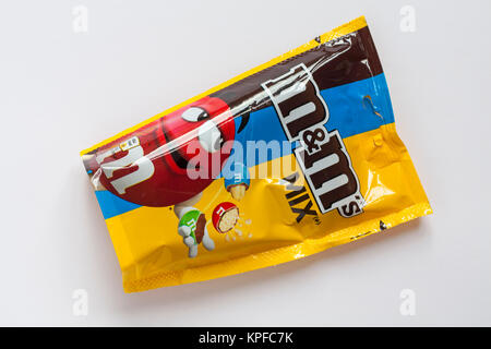 Packet of limited edition crunchy caramel M&Ms isolated on white background  Stock Photo - Alamy