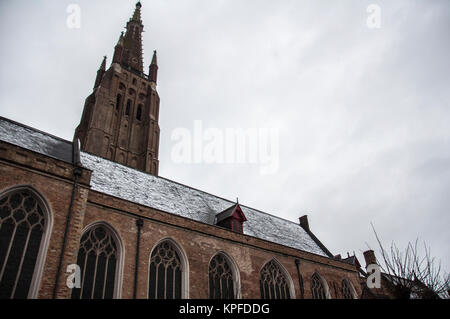 church in brugge, winter day, snow, snowing, bruges, flanders, belgium Stock Photo