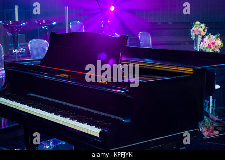 piano with lights in background Stock Photo