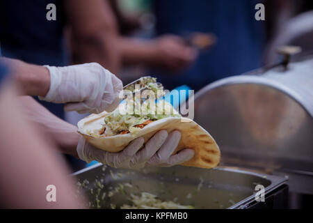 Man cutting and preparing doner kebab Stock Photo