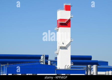 Fire tower at the plant for the processing of scrap metal. Huge factory old metal refiner Stock Photo