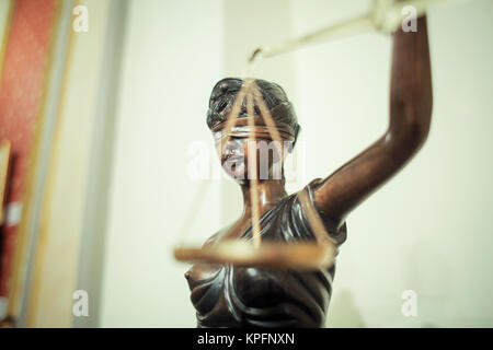 Bronze statue of the blind and impartial Lady Justice holding scales Stock Photo