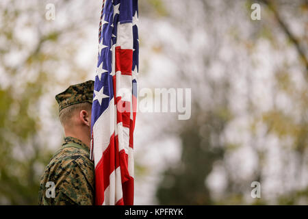 US Army soldier with US flag at a military parade Stock Photo