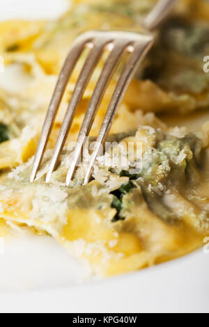 spinatravioli with fork Stock Photo